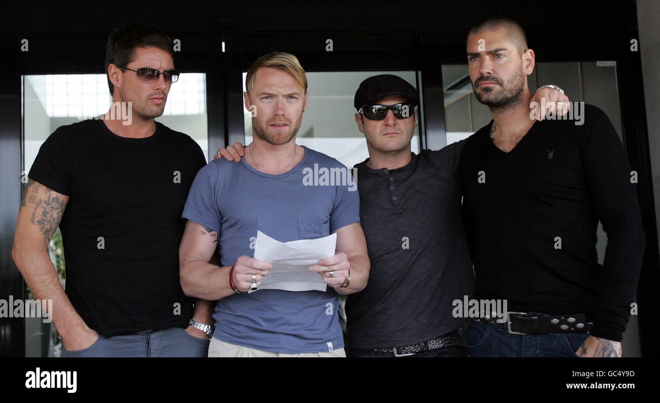 Members of Boyzone (from left) Keith Duffy, Ronan Keating, Mikey Graham and Shane Lynch make a statement outside Majorca Airport as Stephen Gately body is placed in to the hold of a plane which will fly to Dublin ahead of his funeral on Saturday. Stock Photo