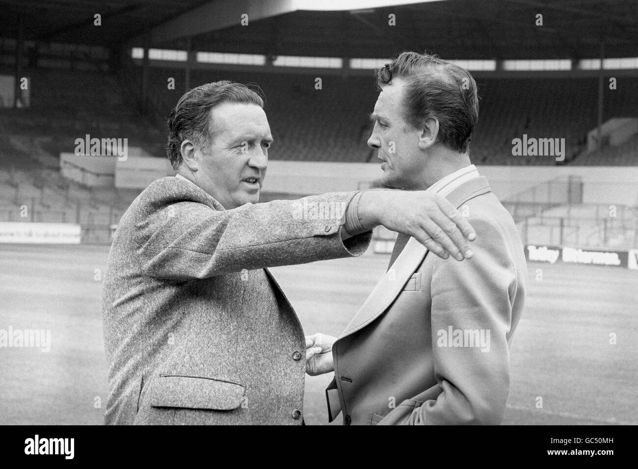 Former Celtic Manager Jock Stein (l) gets together with Leeds United caretaker Manager Maurice Lindlay (r) on the pitch at Elland Road. Jock Stein takes over from Jimmy Armfield as Leeds United Manager. Stock Photo