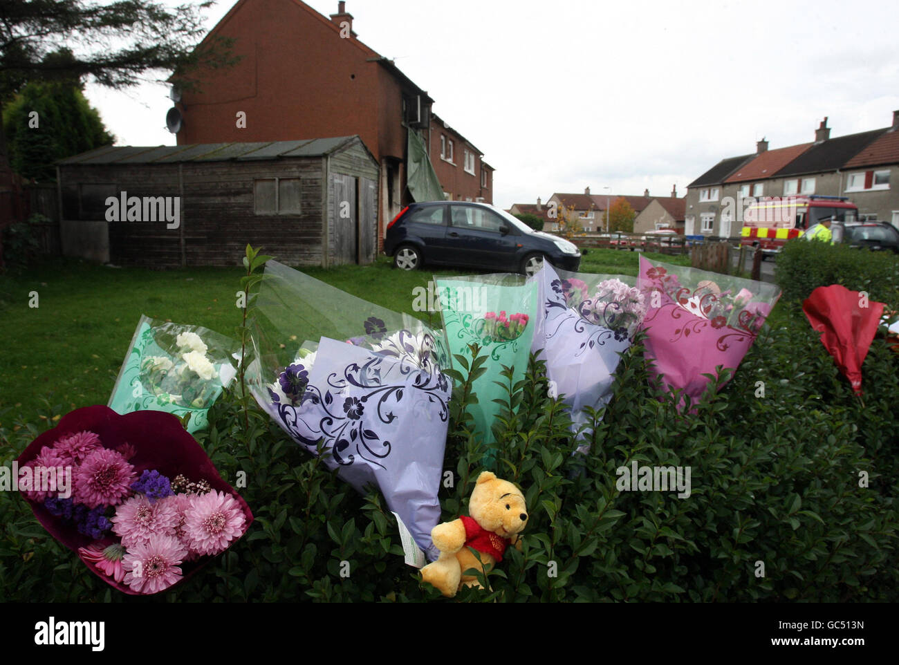 Flowers left at the scene in Devondale Avenue in Blantyre after a house