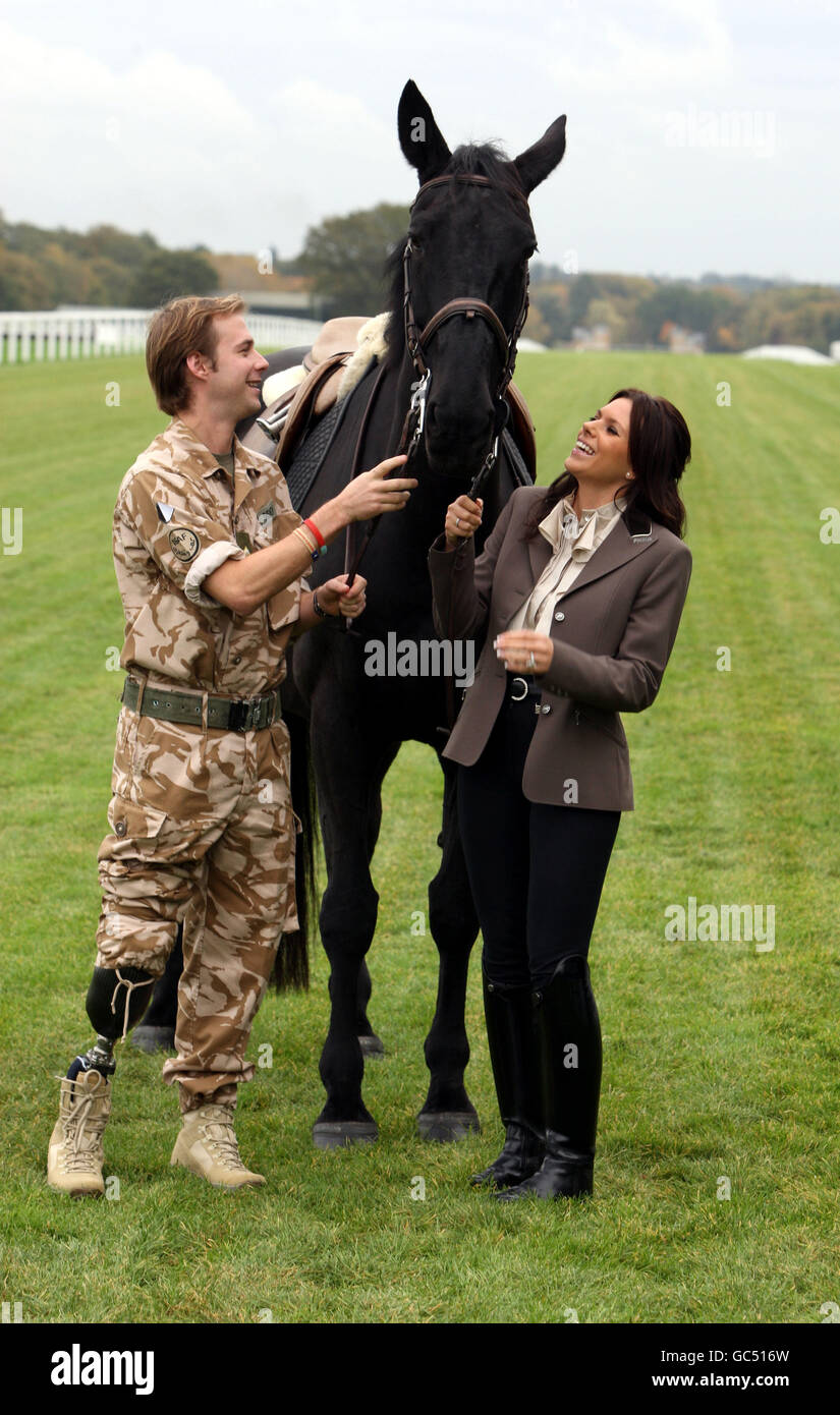 Toni Terry and Lieutenant Guy Disney, an amateur rider for Nicky Henderson, who lost a leg serving in Helmand Province hold Deadnought from the Household Cavalry during a photocall to launch 'Horses For Heroes' in aid of Help For Heroes at Ascot Racecourse in Berkshire. Stock Photo