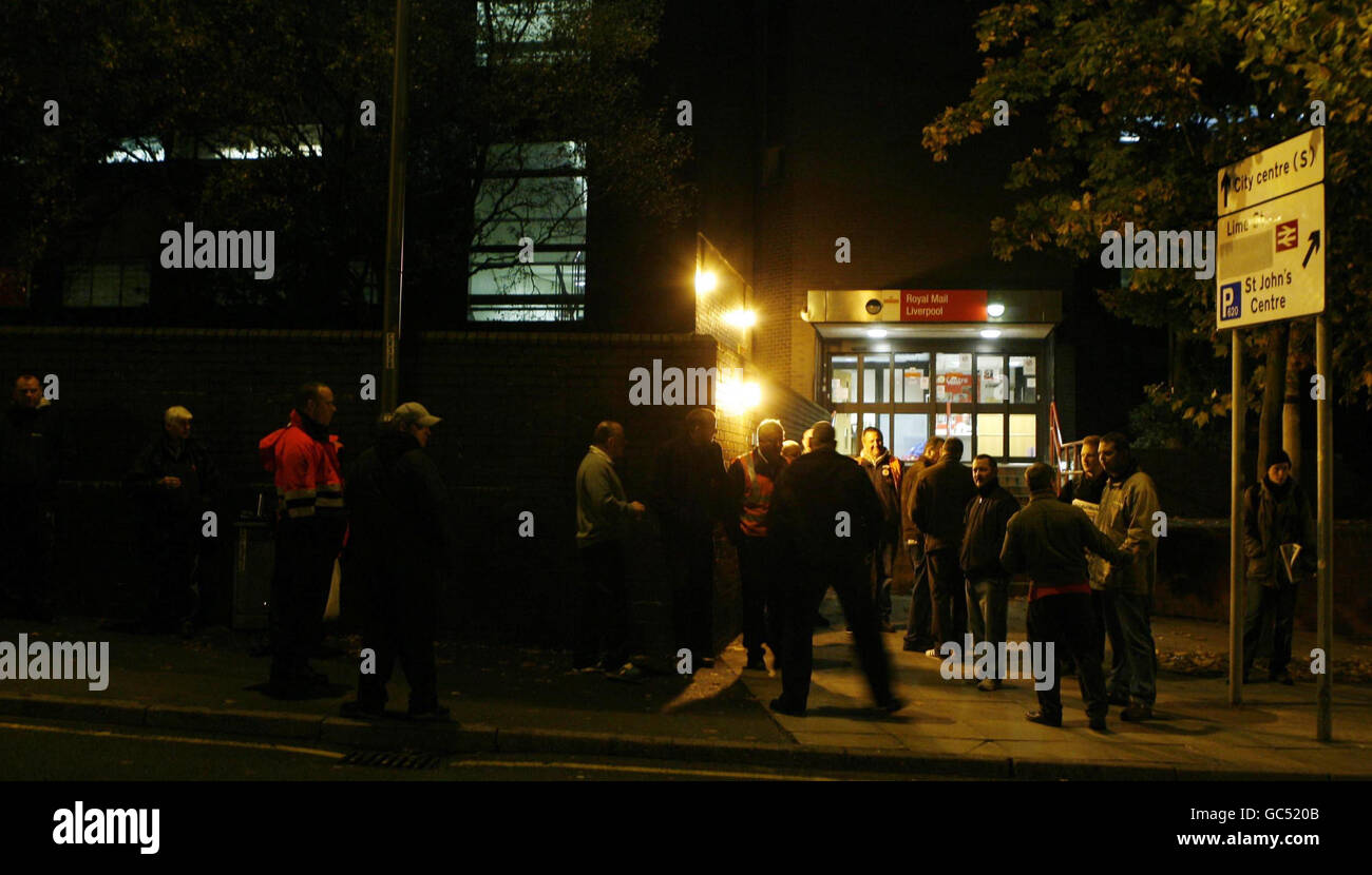 Royal Mail staff on strike stand outside Liverpool's Copperas Hill