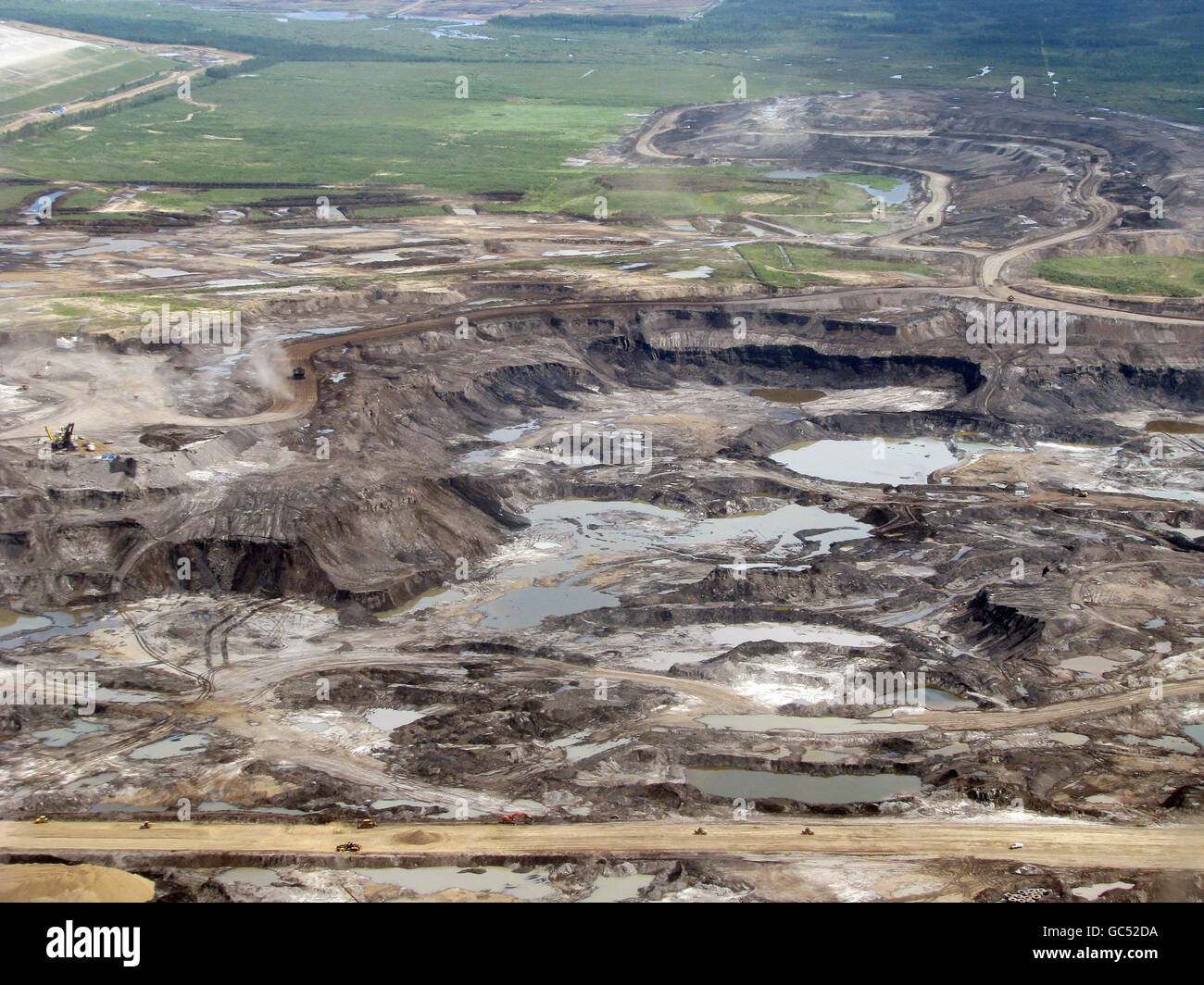 Aerial view of an open cast mine near Fort McMurray, Alberta, Canada, which is being used to extract oil from the Athabasca tar sands fields. Stock Photo