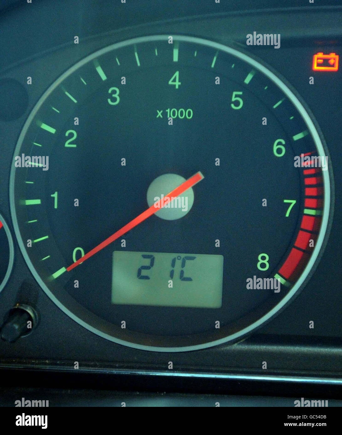 Car dashboard temperature gauge indicates an outside temperature of 21C on the Monmouthshire