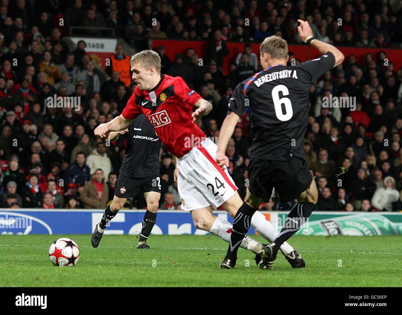 Manchester United's Darren Fletcher goes down in the penalty area after the challenge from CSKA Moscow's Alexei Berezutsky for which he receives a yellow card for diving Stock Photo