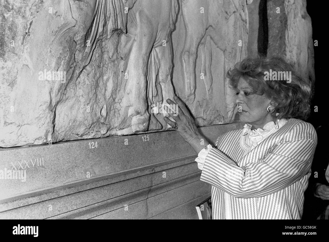Greek actress Melina Mercouri, who is Greek Minister for Culture and Sciences, touches the Elgin Marbles. She is on a four day visit to London and is visiting the Elgin Marbles shown at the British Museum. The Greek Government intend to make an official request for the return of the marbles. The Elgin Marbles have been at the British Museum since the British government purchased them in 1816. Thomas Bruce, 7th Earl of Elgin, removed many of the marbles from the Parthenon after obtaining a controversial permit from the Ottoman authorities to remove pieces from the Acropolis. Stock Photo