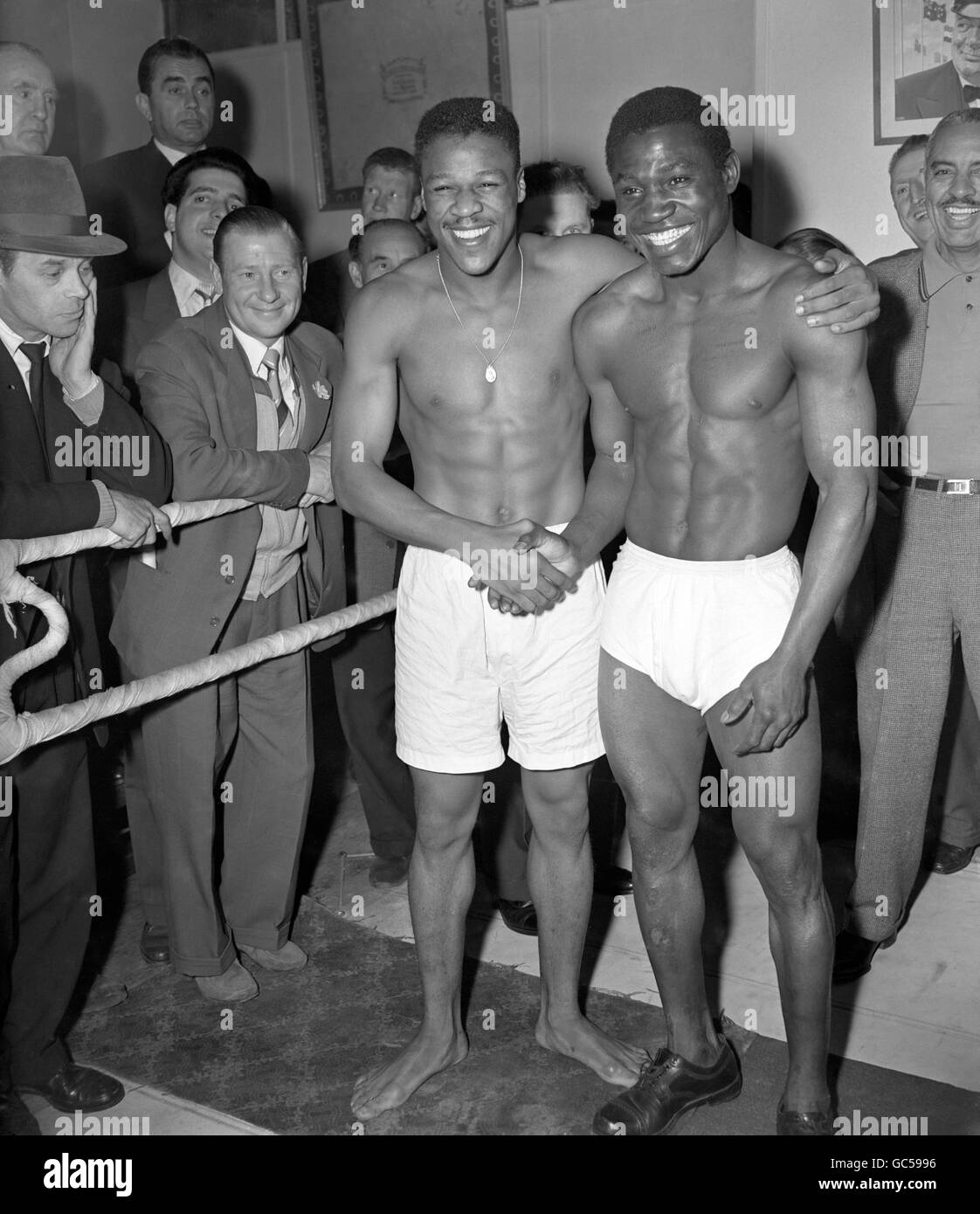 American Spider b (l) shakes hands with Nigerian Dick Tiger (r) at