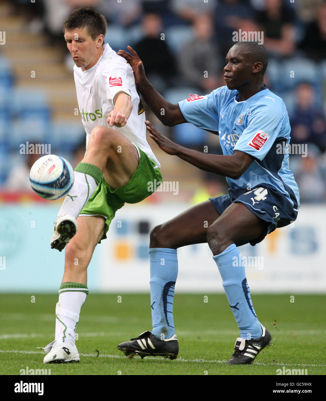 Reading's Grzegorz Rasiak (left) and Coventry City's Jermaine Grandison (right) battle for the ball. Stock Photo