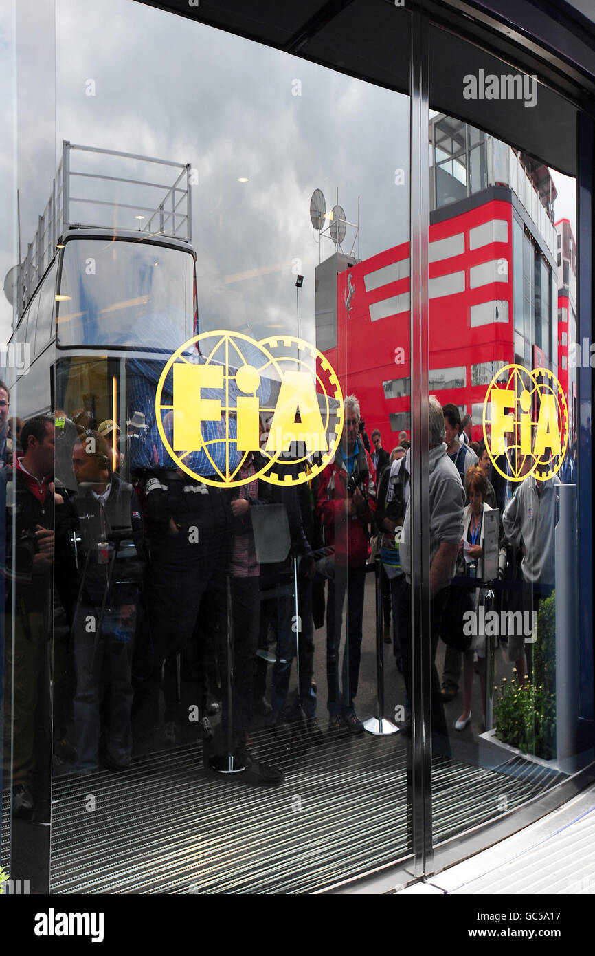 Press wait outside the FIA motorhome during the British Grand Prix at Silverstone