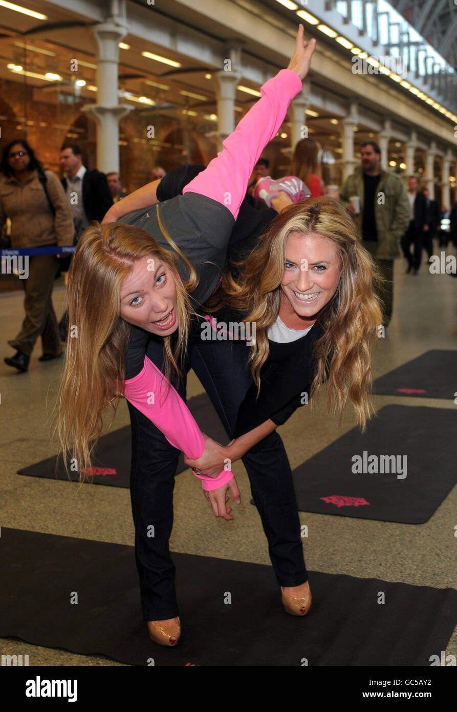 Georgie Thompson, the girlfriend of Declan Donnelly (right), learns self defense as she launches the iamsuperchick.com Female Safety campaign at St. Pancreas International train station in central London. Stock Photo