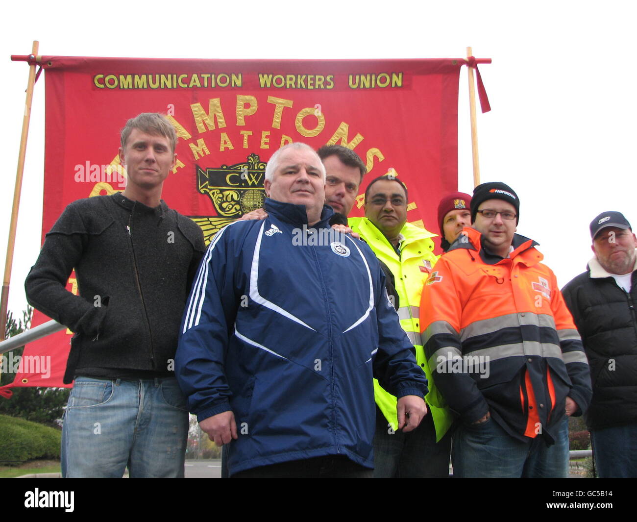 Postal workers in the picket line outside Royal Mail's distribution centre at Crick, Northamptonshire. Stock Photo