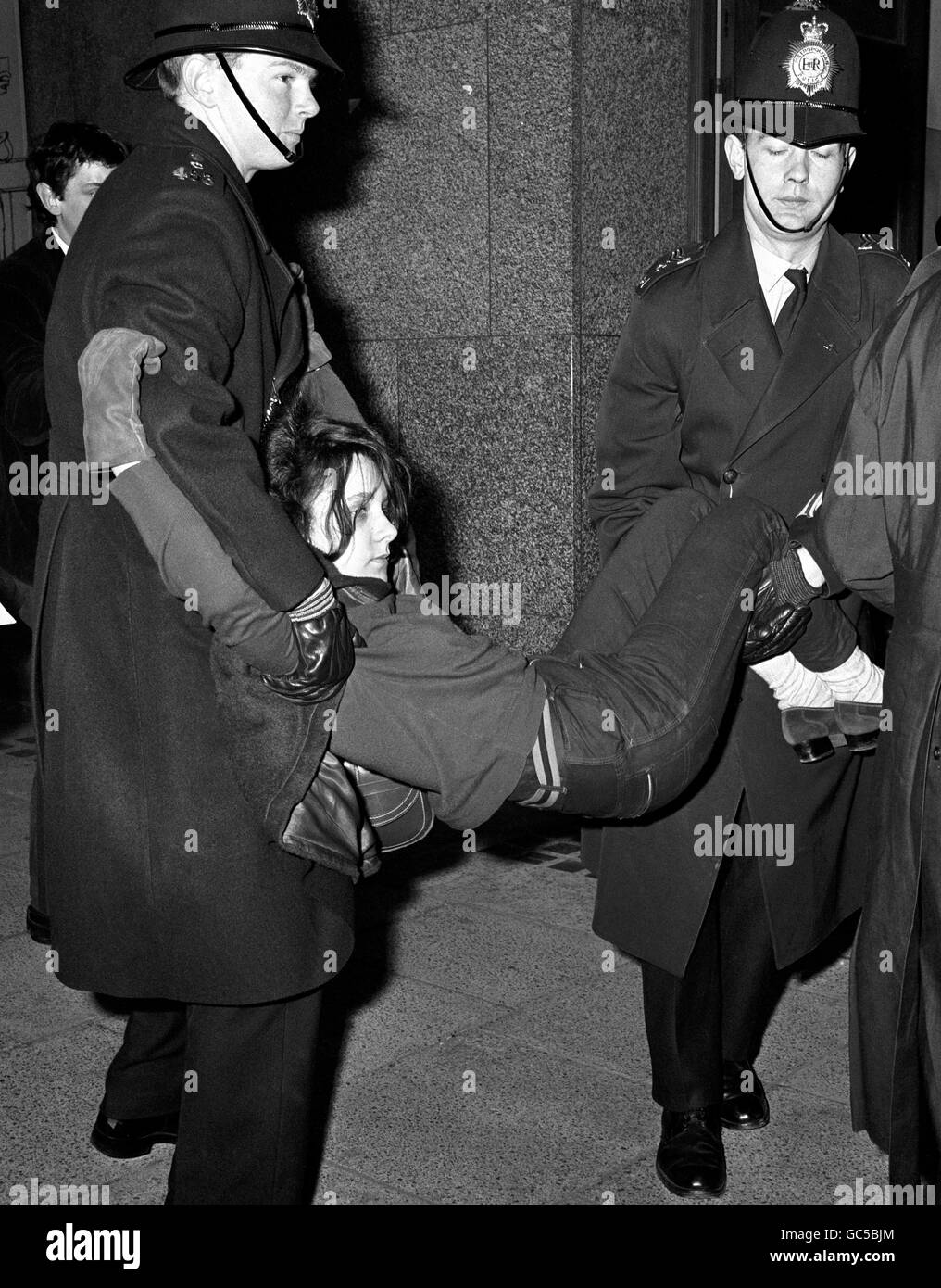 A girl is dragged by policemen out of Connaught House, Aldwych, the administrative block of the London School of Economics, where more than a dozen police were removing students and sitting them on the pavement outside. The students are protesting against the suspension of two of their leaders. Stock Photo