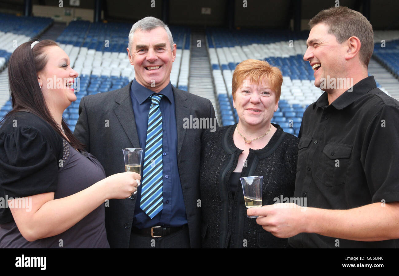 (left to right) Lisa Dougan, Charles MacDonald with his wife Liz MacDonald and Mark Page some of Scotland's lottery winners who gathered at Hampden Stadium in Glasgow today to celebrate the 15th anniversary of the National Lottery. Stock Photo