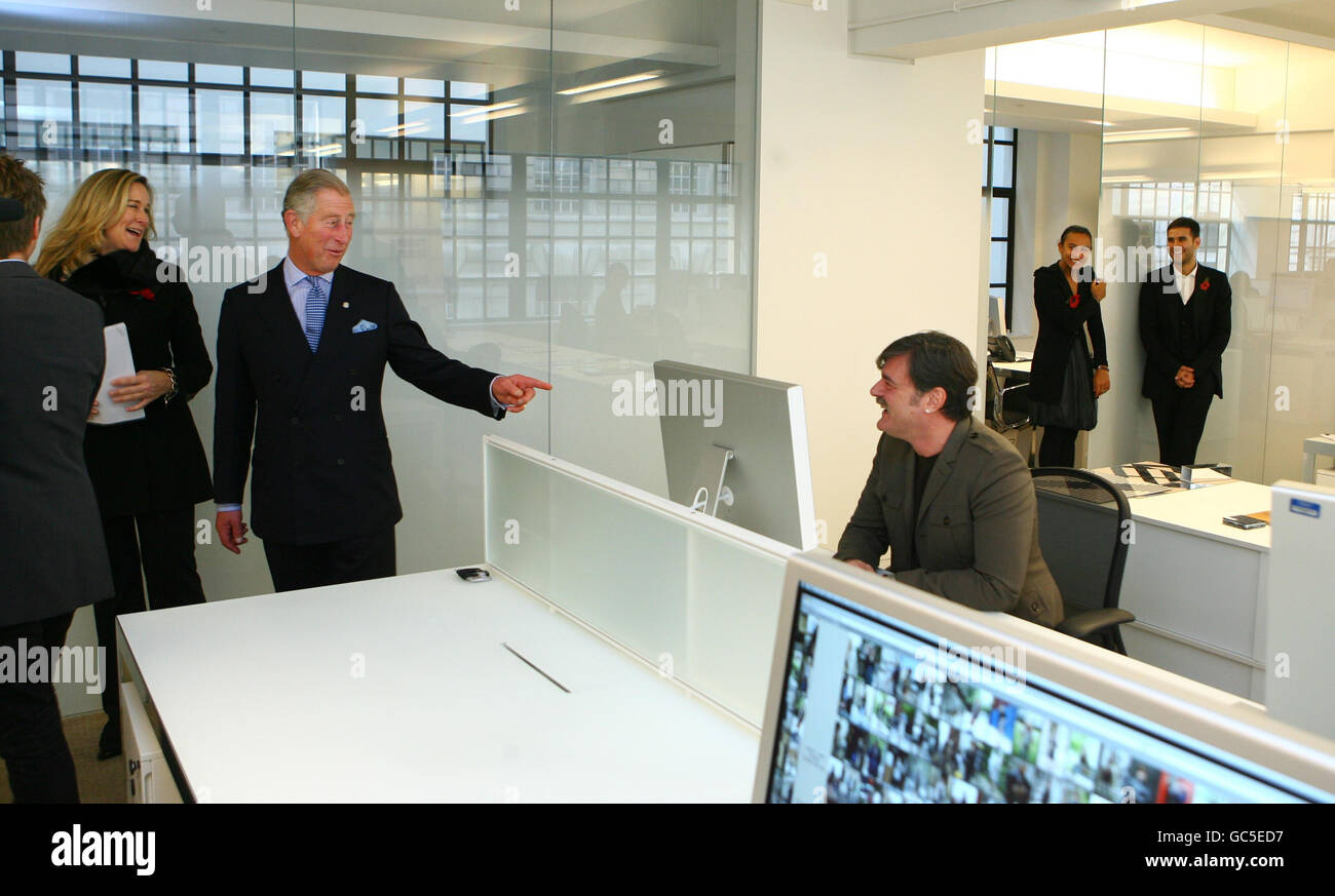 The Prince of Wales shares a joke with a Burberry employee and the  company's chief executive Angela Ahrendts (left), as he officially opens  the new Burberry global headquarters at Horseferry House in