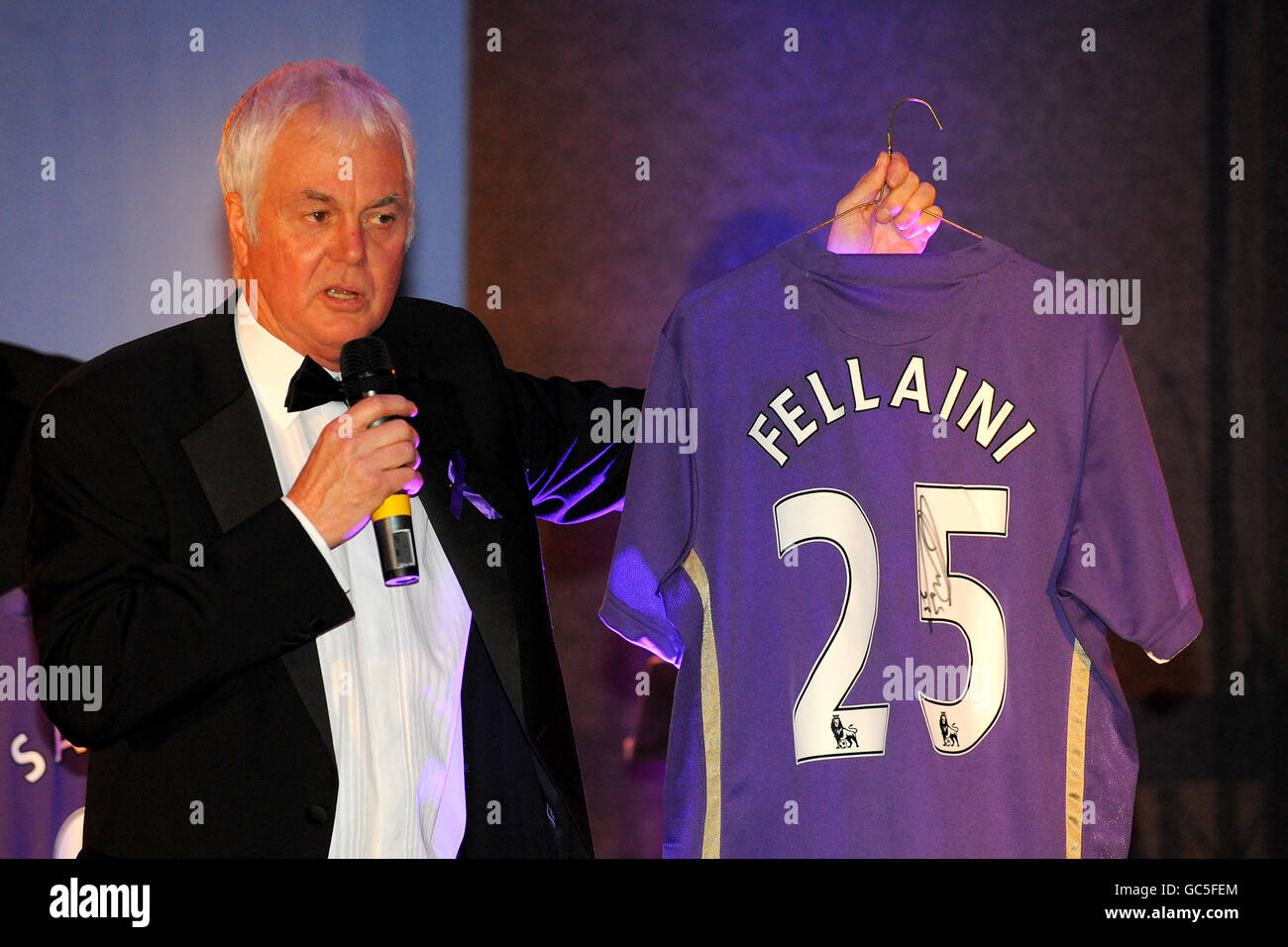 A signed limited editon purple Marouane Fellaini shirt is auctioned off Stock Photo