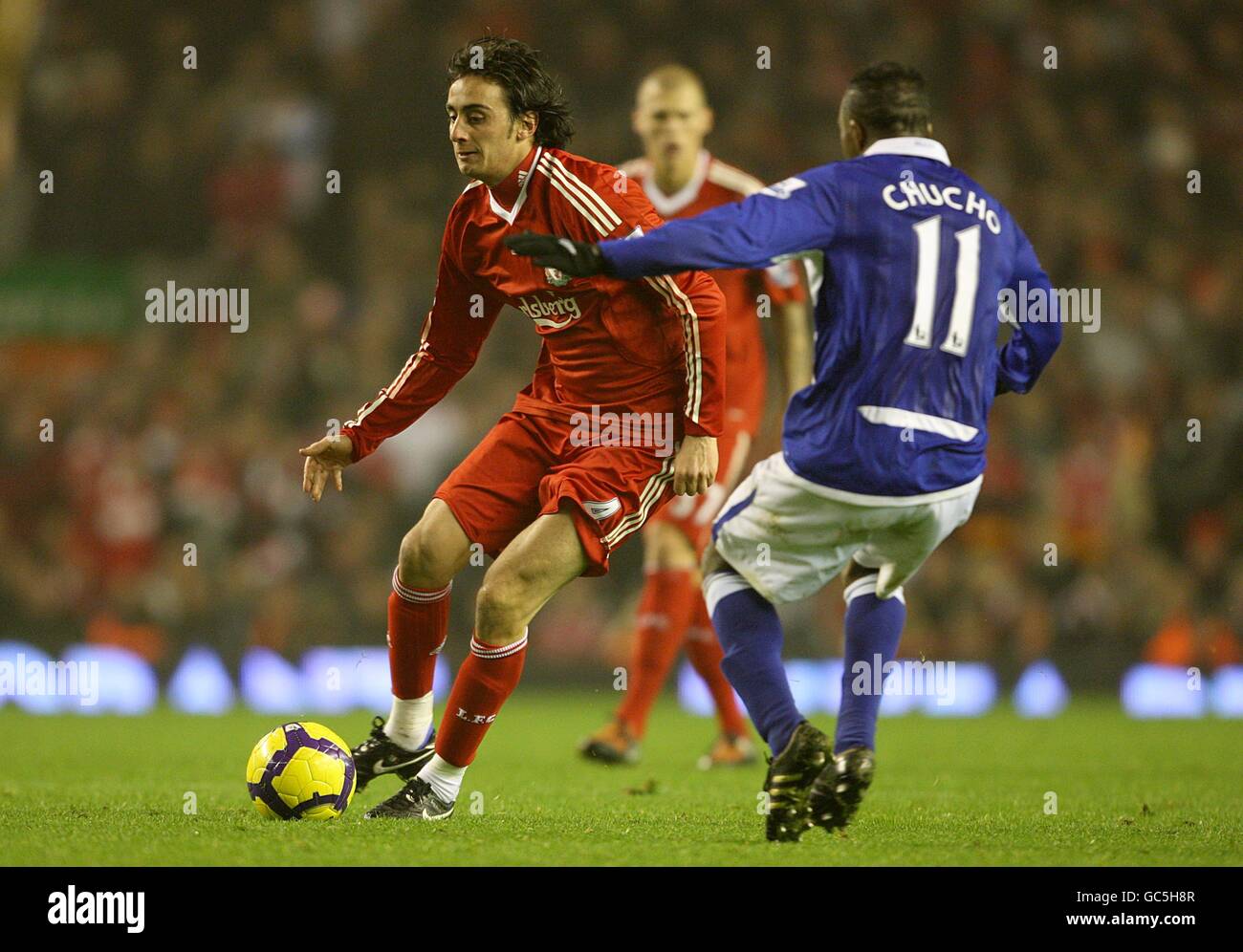 Liverpool's ALberto Aquilani (left) and Birmingham City's Christian Benitez (right) battle for the ball Stock Photo