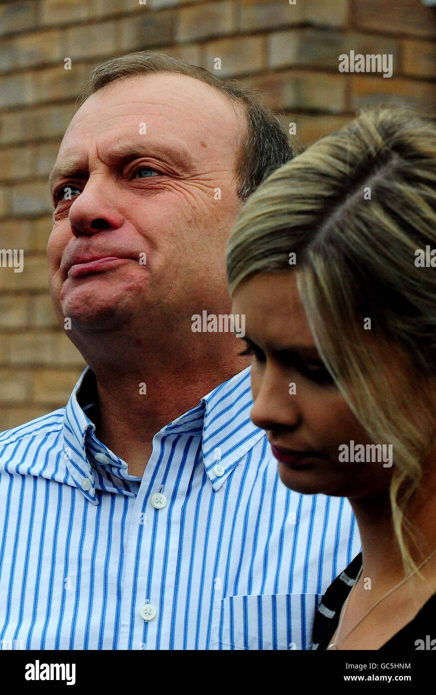 Bill Hawker, the father of British teacher, Lindsay Ann Hawker who was murdered in Japan, stands with his daughter Lisa, speak to the media outside their home in Brandon, Coventry, following the arrest of her suspected killer. Stock Photo
