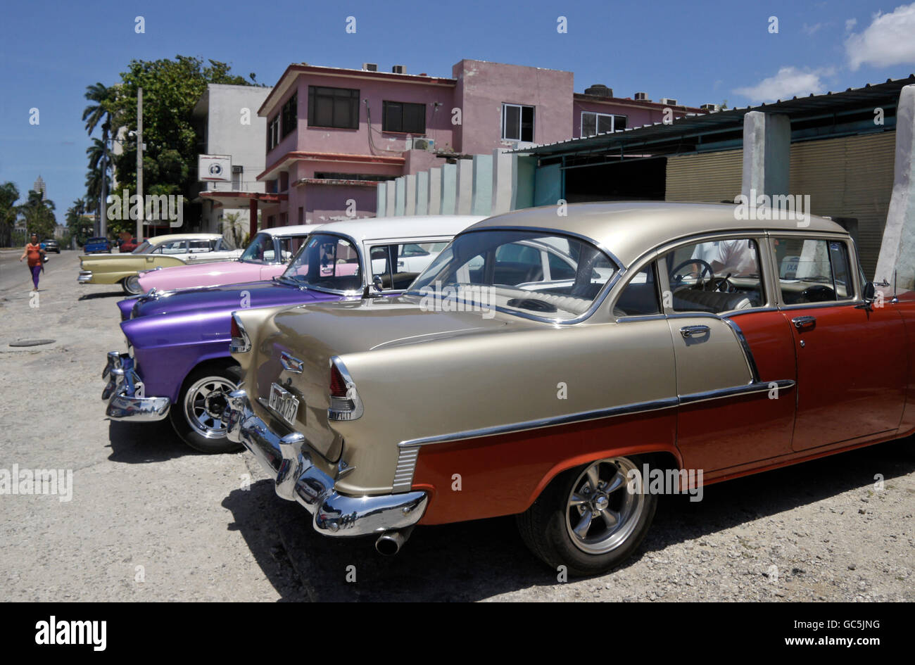 Restored classic American cars parked in front of NostalgiCar garage, Havana, Cuba Stock Photo