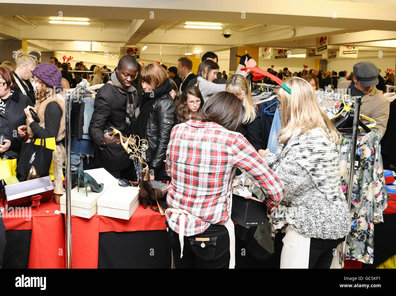 Shoppers at Louise Redknapp's stall at the Mothers4Children Really, Really Great Garage Sale at Selfridges in London. Stock Photo