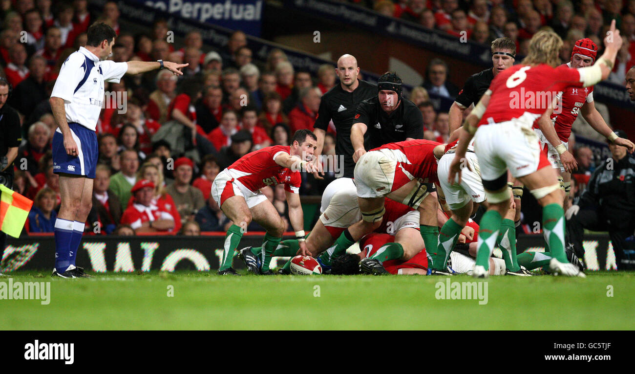 Wales scrum half Gareth Cooper (centre) points as does Andy Powell (no6) and referree Criag Joubert (left) during the Invesco Perpetual Series match at the Millennium Stadium, Cardiff. Stock Photo