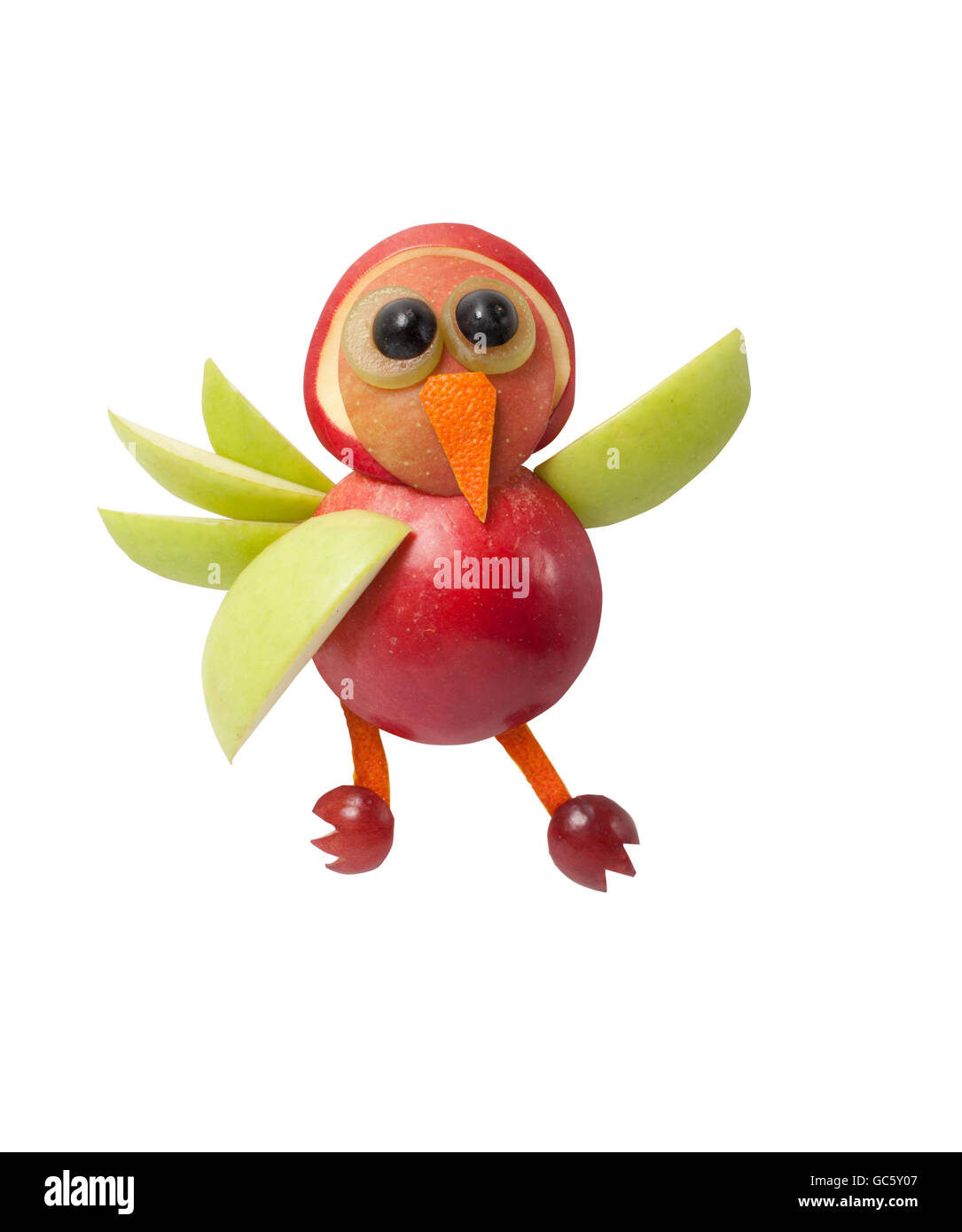 Waving bird made of fruits on clear background Stock Photo - Alamy