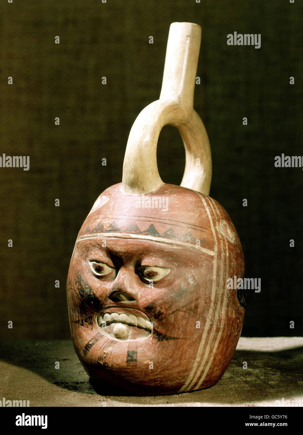 fine arts, South America, Peru, Mochica culture (Moche), handicrafts, handle can: tattooed head of a man with face mutilation as effect of the Espundia, burial object, clay, circa 600 AD, private collection, Stock Photo