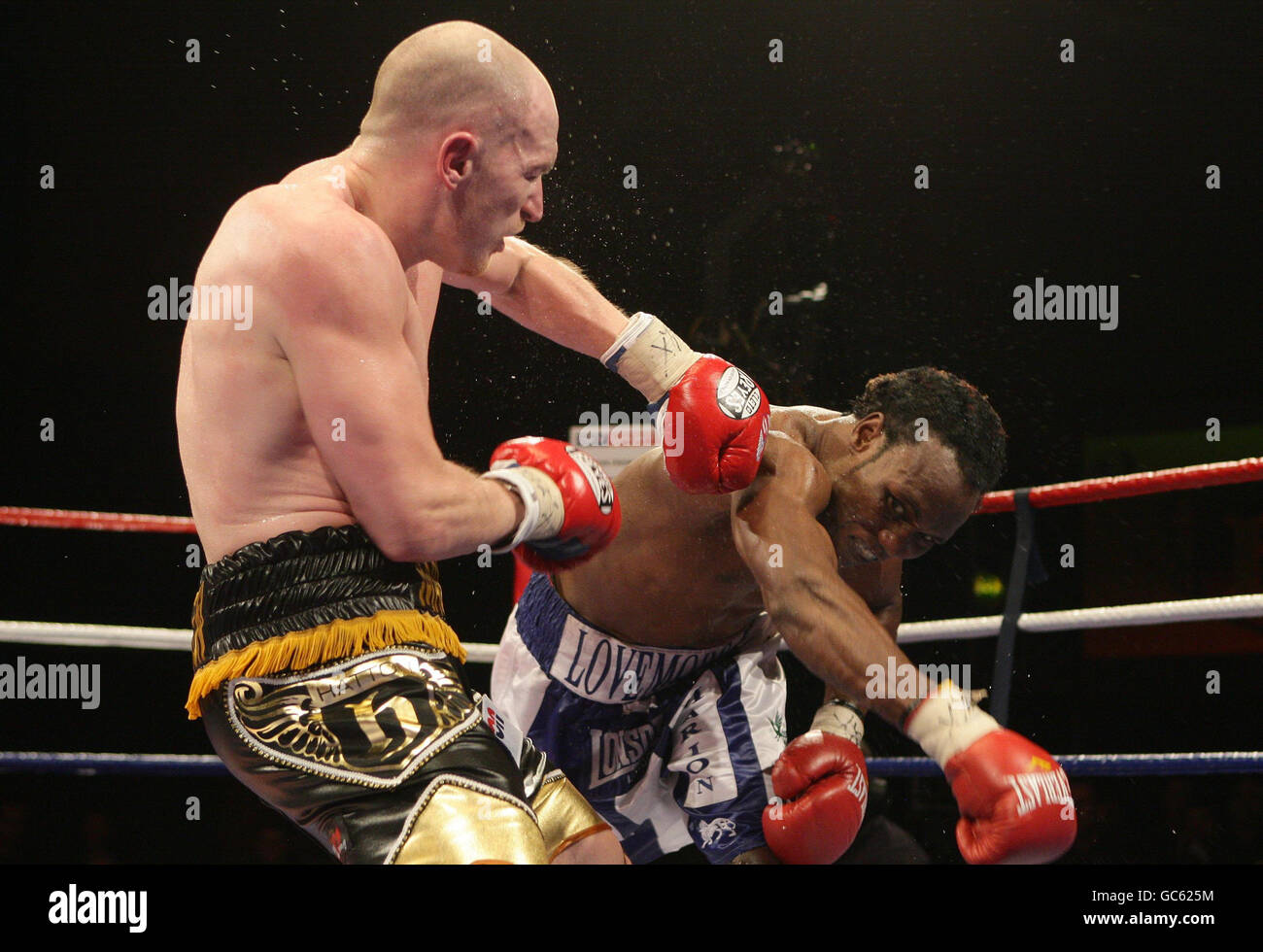 Matthew Hatton (left) in action against Lovemore N'Dou (right) during their IBO Welterweight Title fight at the Fenton Manor Sports Complex, Stoke on Trent. Stock Photo