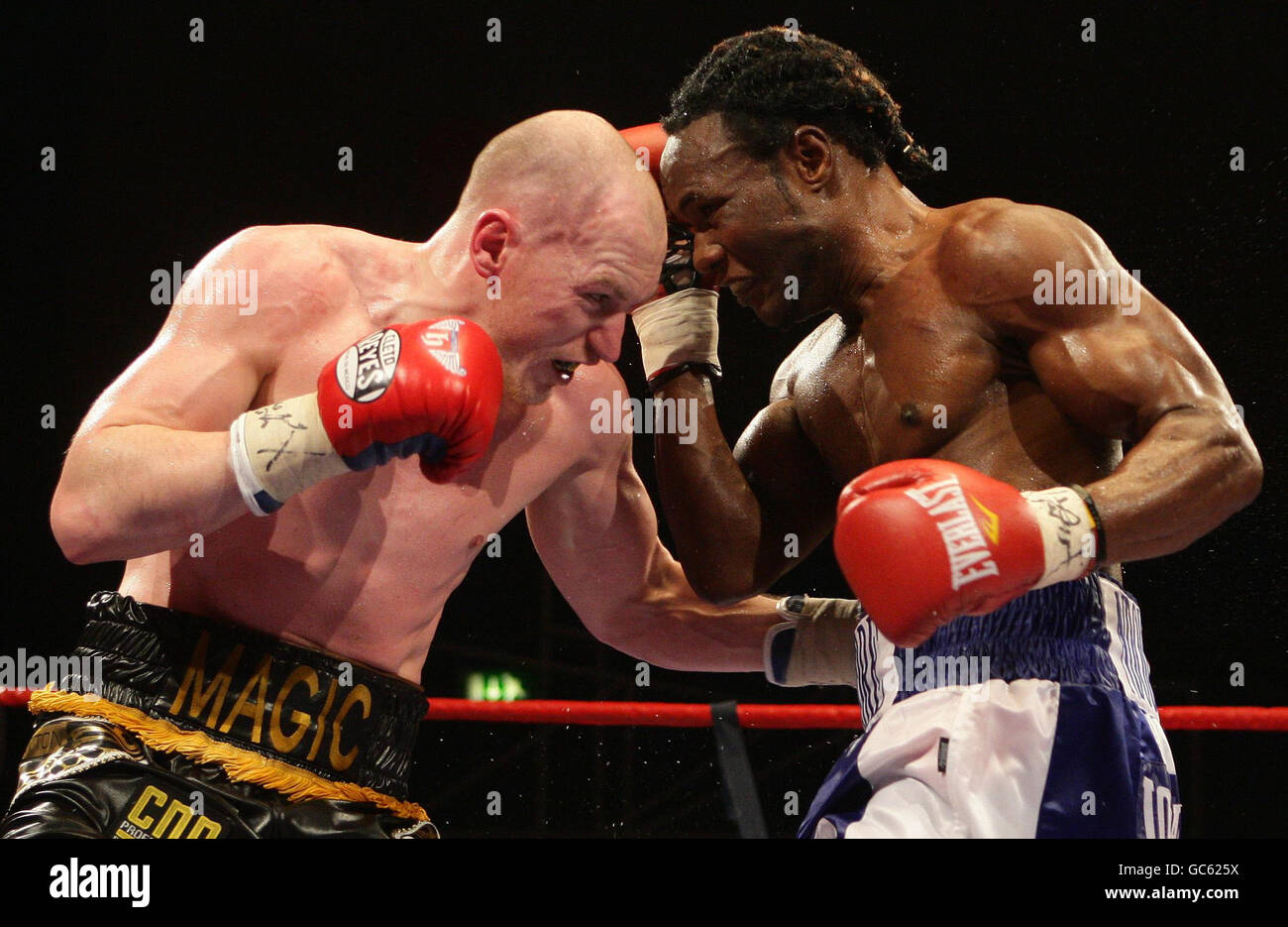 Matthew Hatton (left) in action against Lovemore N'Dou (right) during their IBO Welterweight Title fight at the Stoke on Trent. Stock Photo