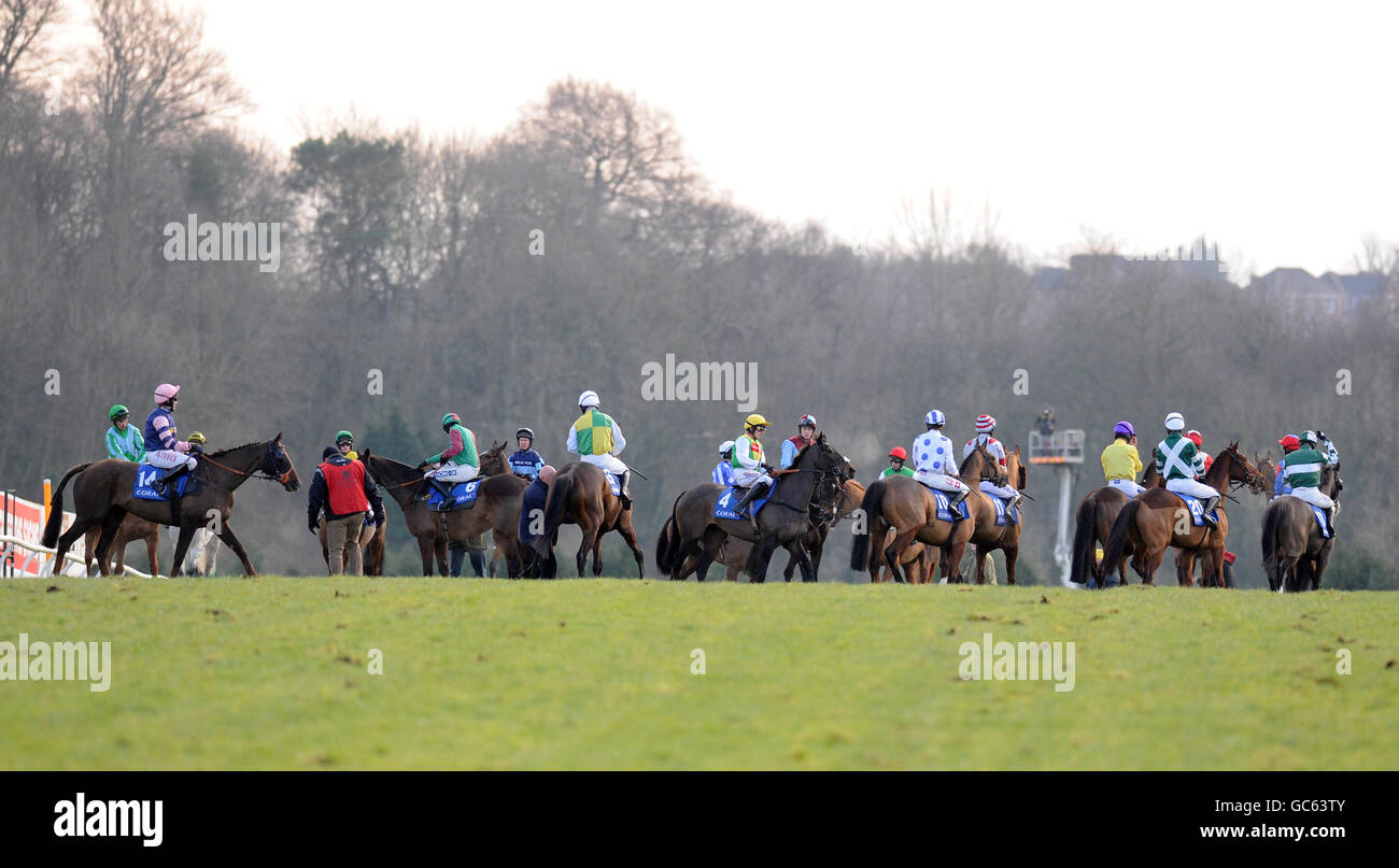 Runners and riders in The Coral Welsh National gather around waiting for the off Stock Photo