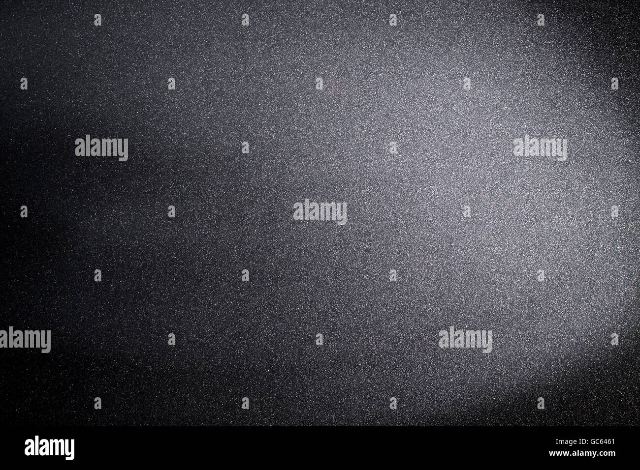 Black grainy stone background. Stock Photo