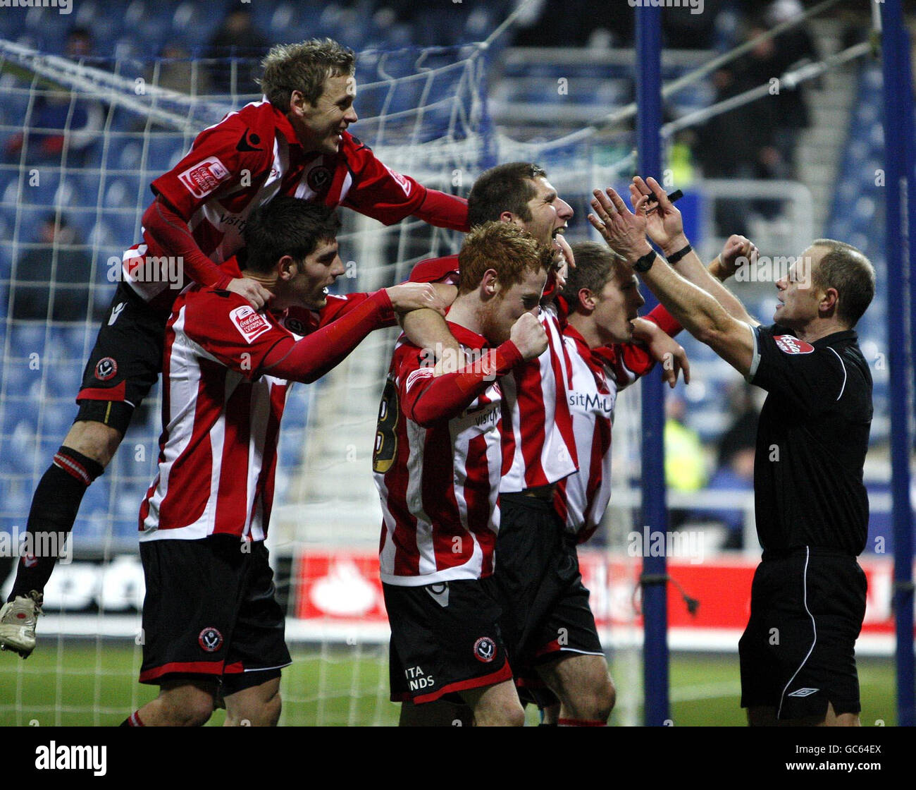 Sheffield United's Richard Cresswell celebrates his goal with teammates during the FA Cup Third Round Replay at Loftus Road, London. Stock Photo