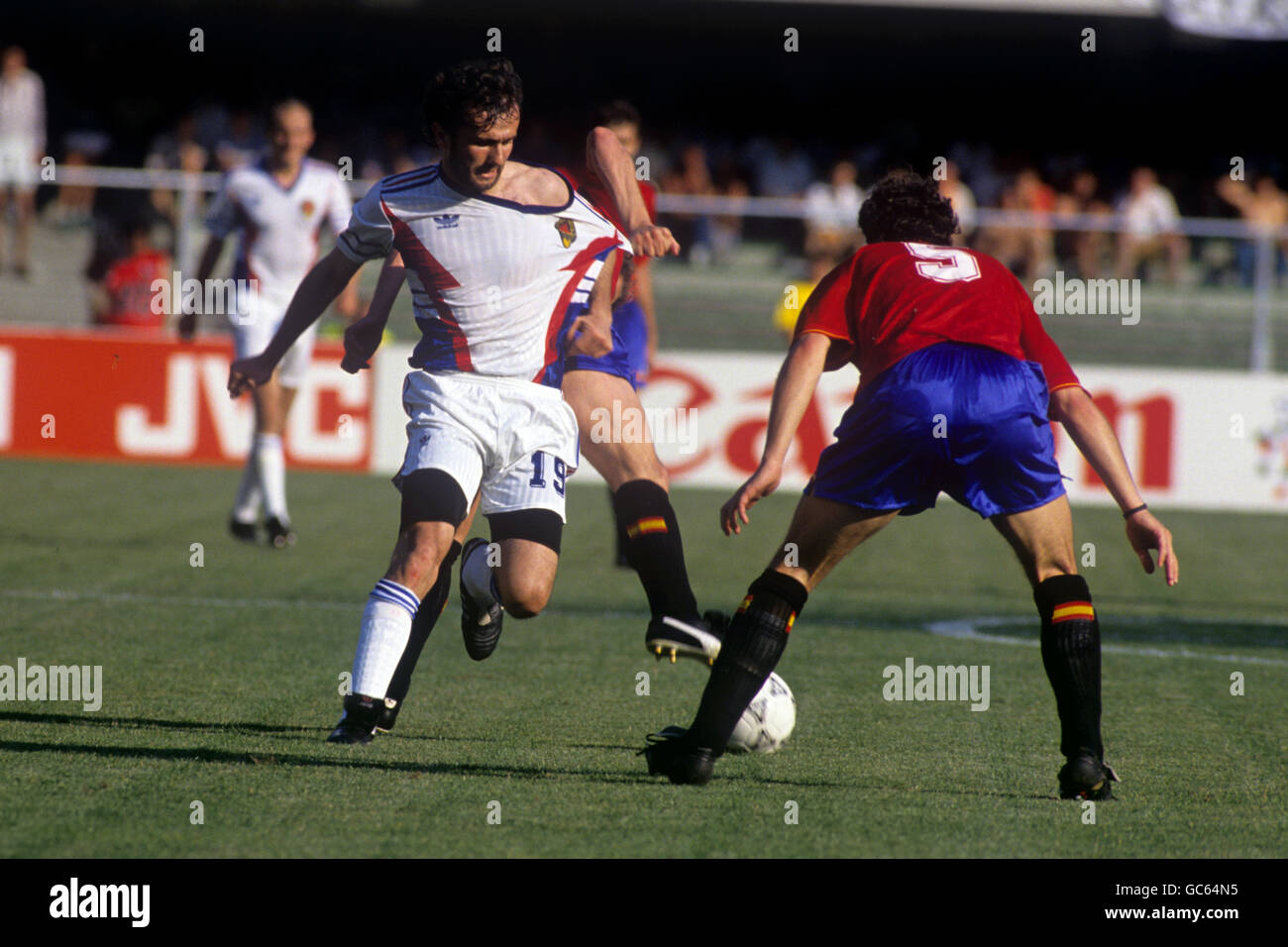 Yugoslavia's Dejan Savicevic has his shirt pulled as he tries to