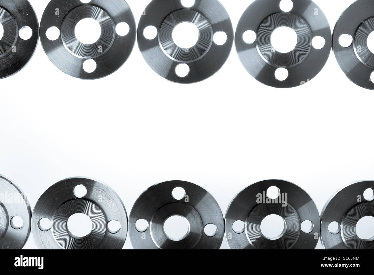 Border of flat steel welding flanges on white background. Stock Photo