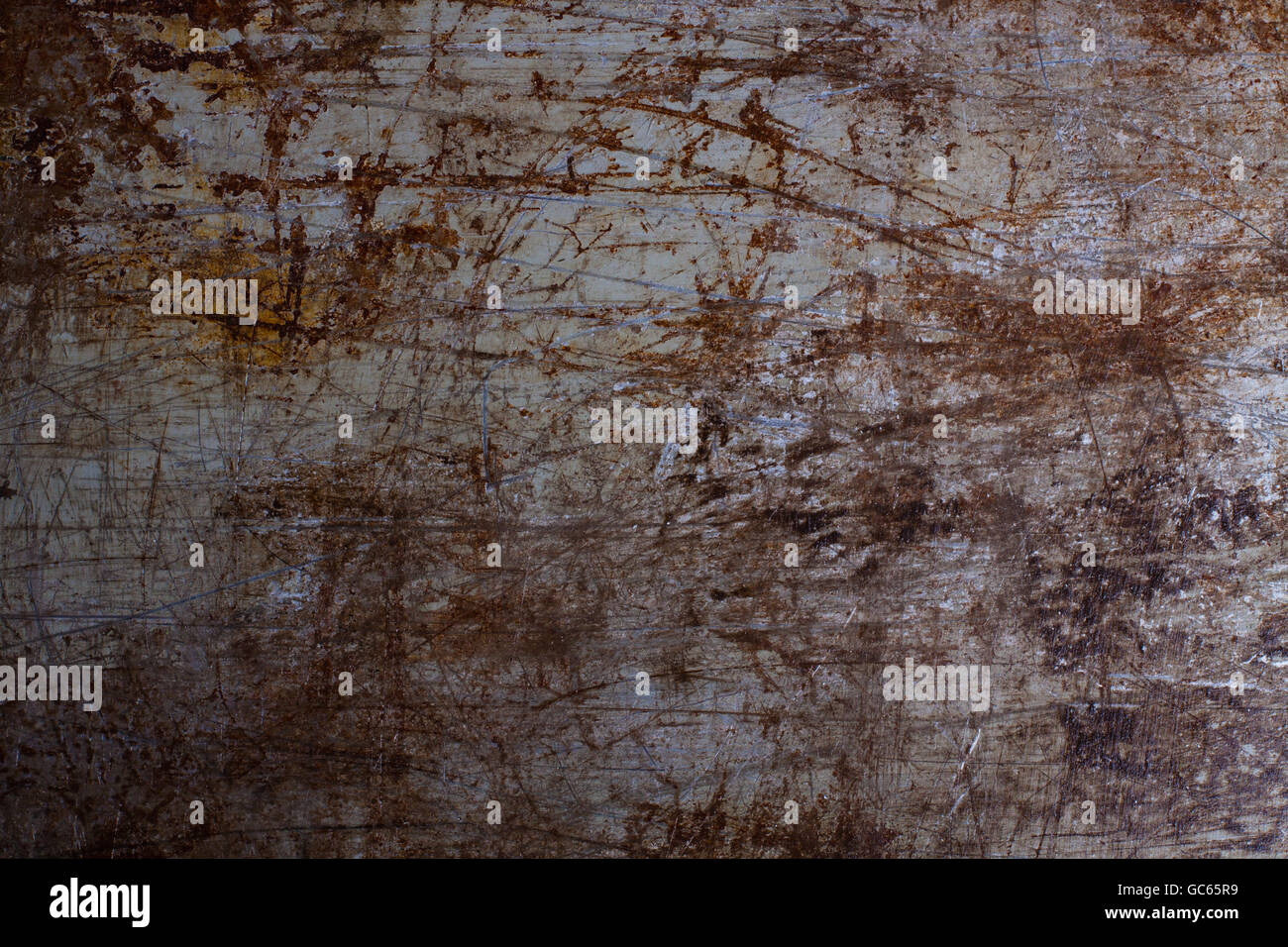 Wallpaper of scratch and rusty metal, painted on gray. Stock Photo