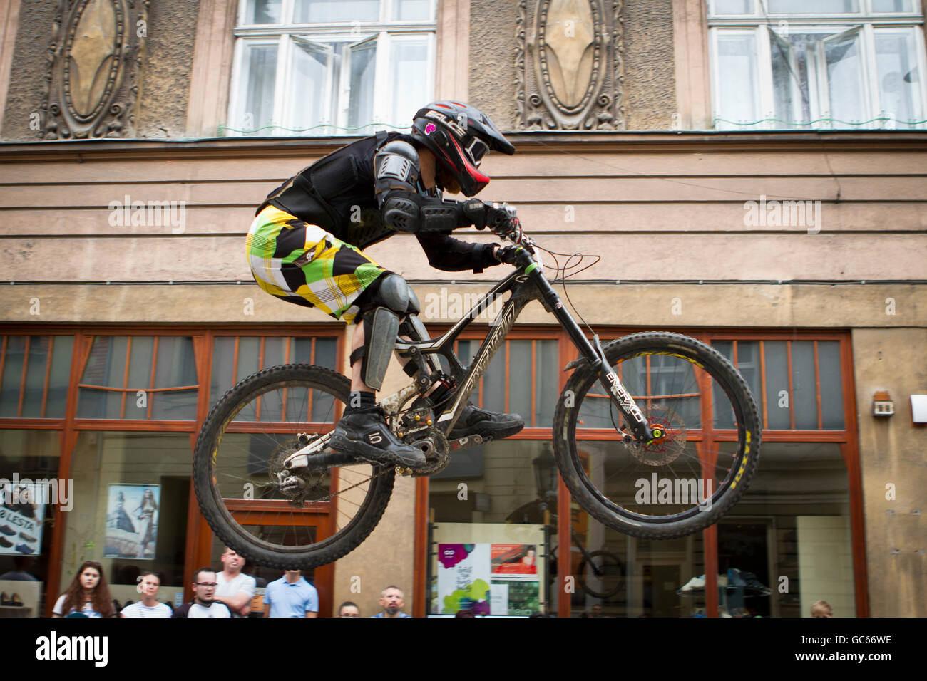 Downhill city tour. Biker jumps over the ramp during mountain bike race on  the streets of Cieszyn. Poland Stock Photo - Alamy