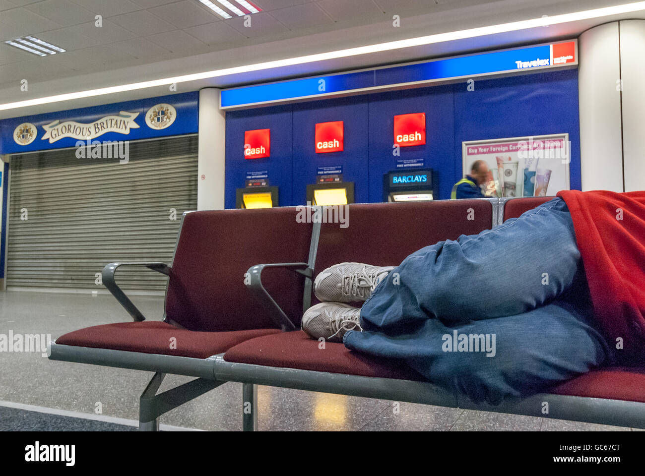 An unidentified homeless man sleeping overnight at Gatwick Airport Stock Photo Alamy