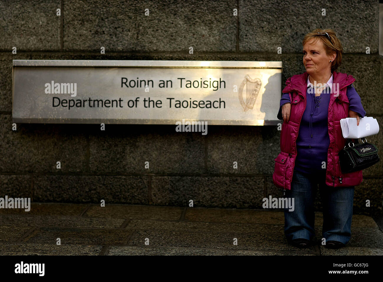 Maggie Woods, chairperson of the Irish Thalidomide Association, waits outside Government Buildings, Dublin, before handing in a letter addressed to Taoiseach Brian Cowen requesting a meeting with him. Stock Photo