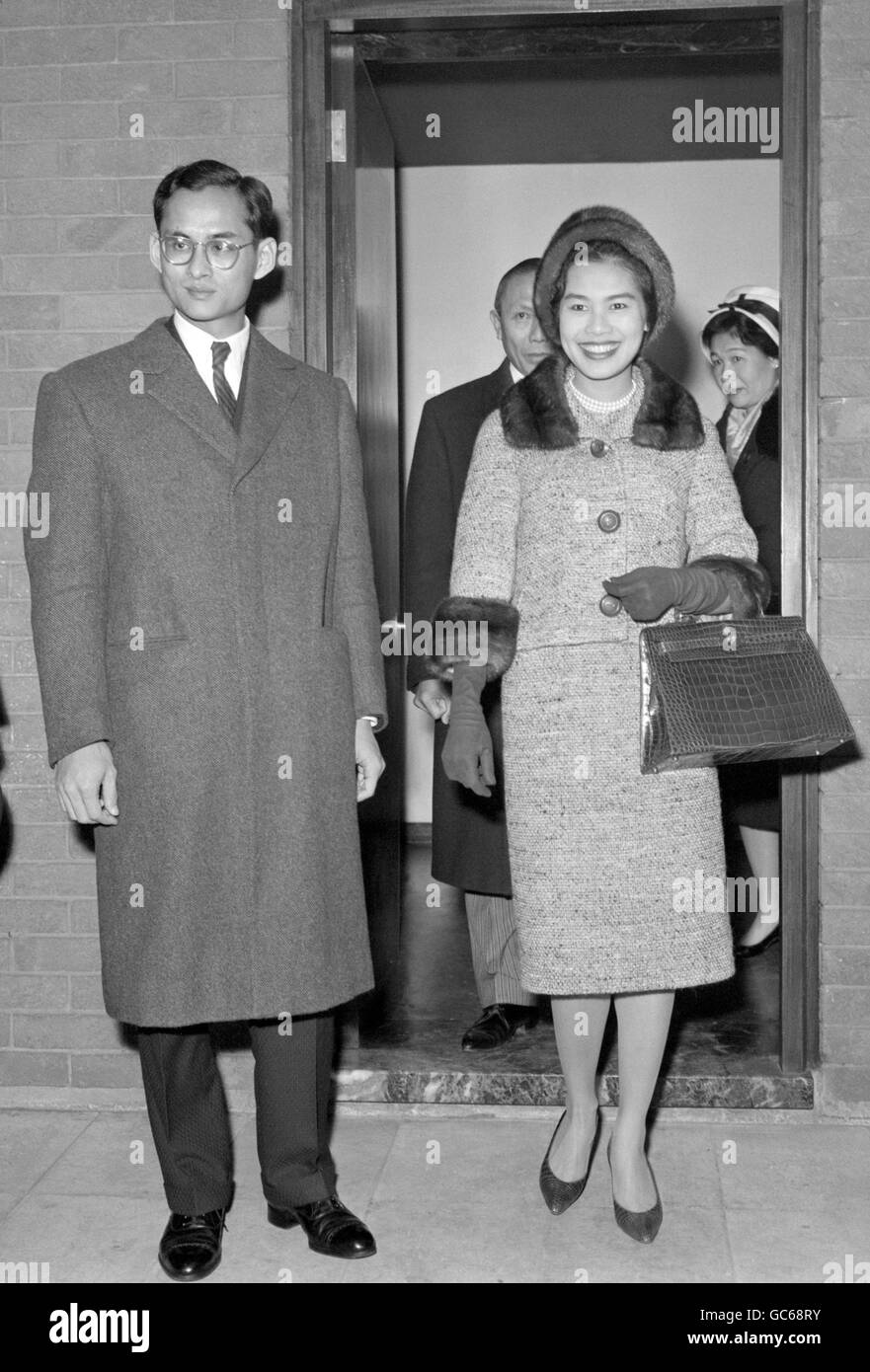 King Bhumibol Adulyadej of Thailand and his consort, Queen Sirikit, arrive at London Airport from Switzerland. Stock Photo