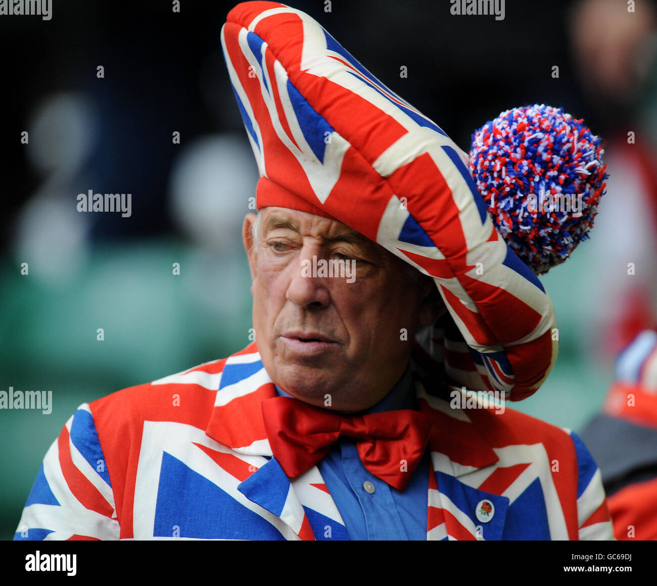 An england fan wear a union flag suit and hat hires stock photography