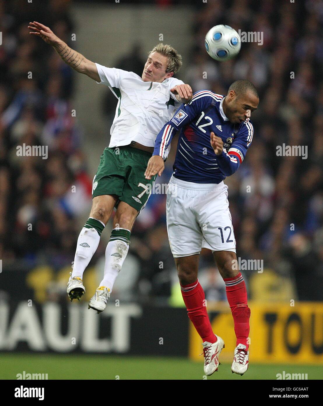 Ireland's Liam Lawrence (left) and France's Thierry Henry battle for the ball Stock Photo