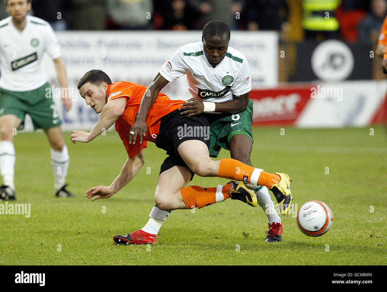 Dundee United's Craig Conway and Celtic's Landry N'Guemo battle for the ball during the Clydesdale Bank Scottish Premier League match at Tannadice Park, Dundee. Stock Photo