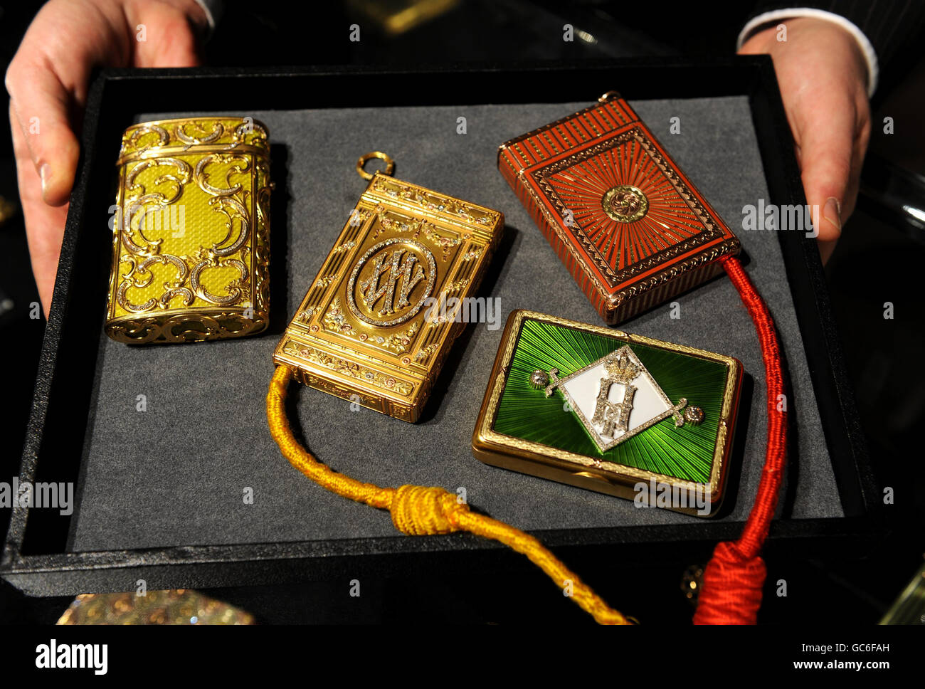 A collection of Faberge cigarette cases are seen during the preview of 'Romanov Heirlooms: The lost Inheritance of the Grand Duchess Maria Pavlovna' at Sotheby's, London. Stock Photo