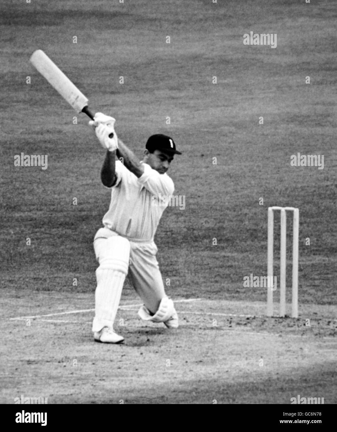 J.H.Edrich (England) attempts a big hit off T.R.Veivere (Australia) which was taken by wicket-keeper A.T.W.Grout Stock Photo
