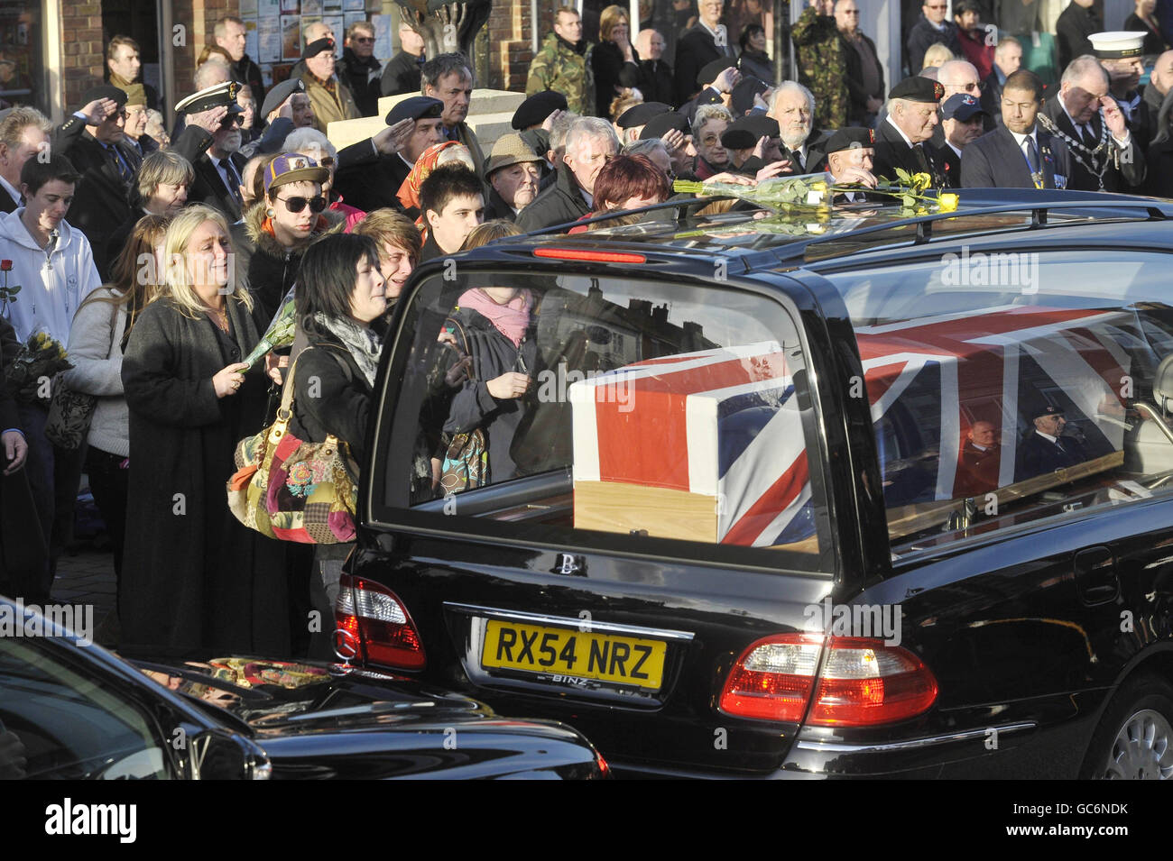 Mourners weep at a repatriation through the Wiltshire town of Wootton Bassett as the bodies of Rifleman Philip Allen, 20, of 2nd Battalion The Rifles and Samuel John Bassett, 20, of 4th Battalion The Rifles pass through the High Street. Stock Photo