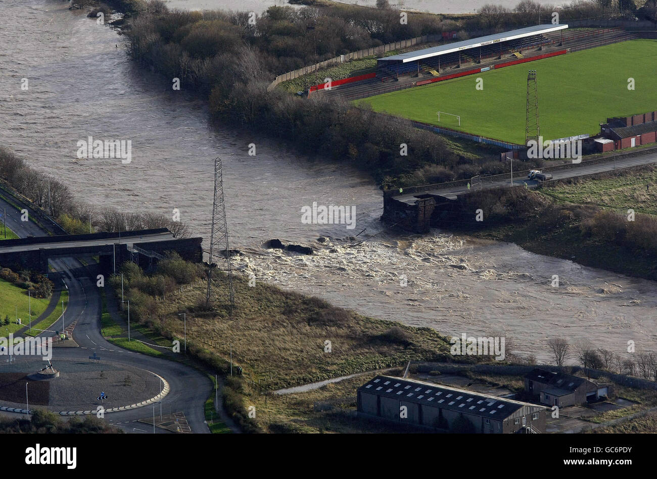 An aerial view of the destroyed Northside bridge, in Workington as floods submerge large parts of Cumbria. Stock Photo