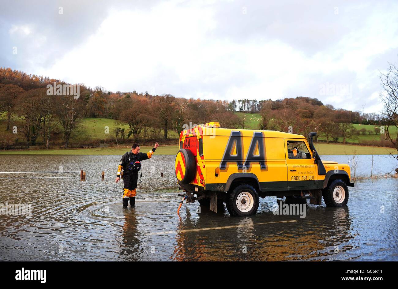 Flooding in UK. The AA rescue a car near Cockermouth, Cumbria as floods ...