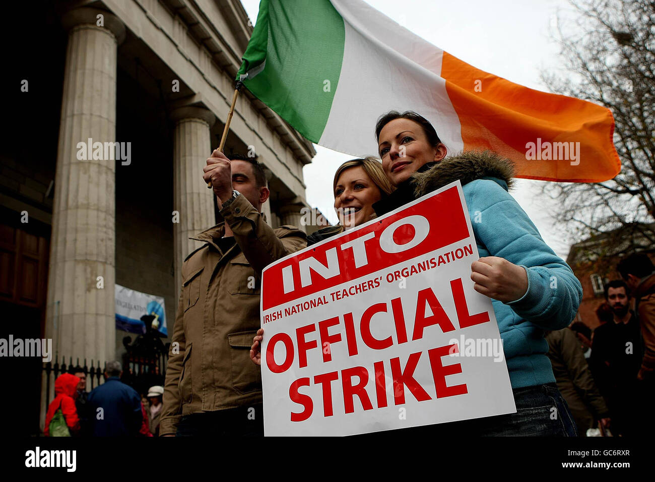 Members of the teaching profession gather outside the Department of Education in Dublin, as 250,000 public service workers hold a one-day nationwide strike. Stock Photo