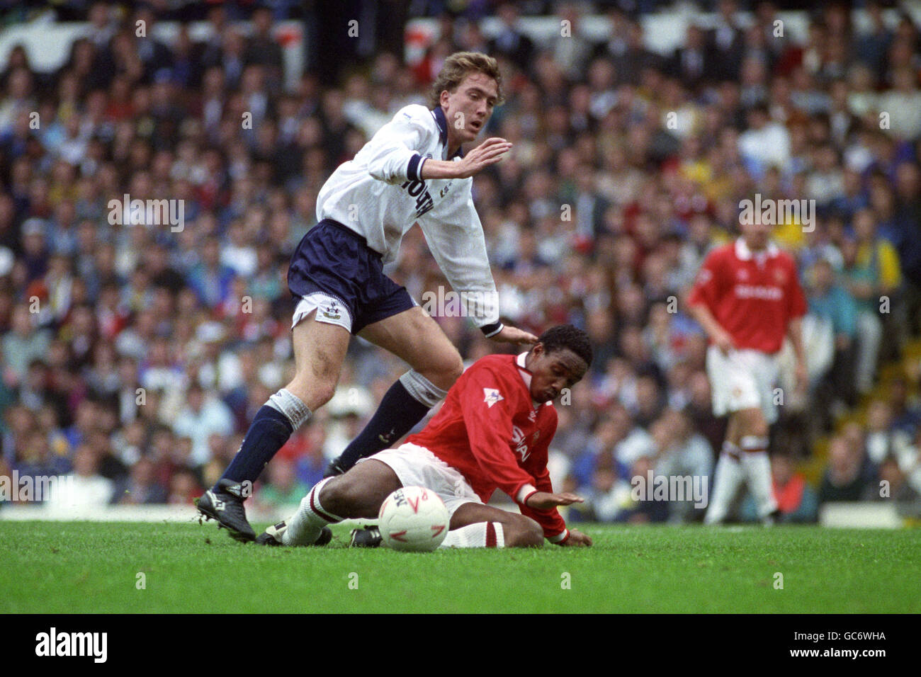 MANCHESTER UNITED'S PAUL INCE (ON FLOOR) AND TOTTENHAM HOTSPUR'S DAVID