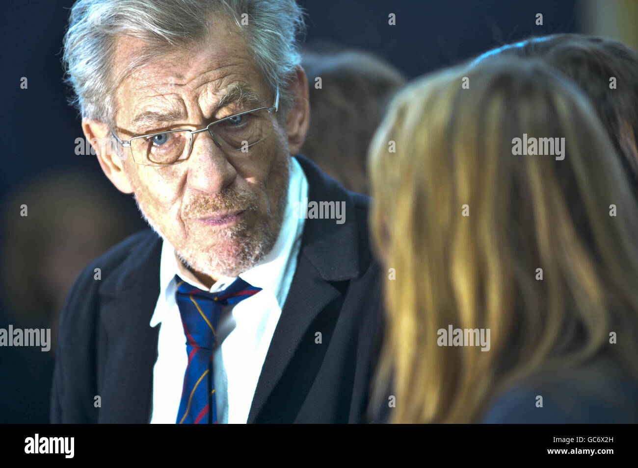 Sir Ian McKellan chats with pupils from Severn Vale School in Gloucester before watching a play performed by pupils from the school with an anti-homophobic bullying message. Stock Photo