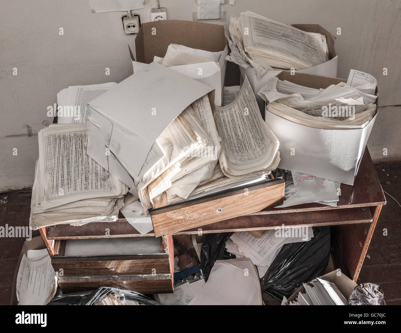 Messy workplace with stack of the paper Stock Photo - Alamy