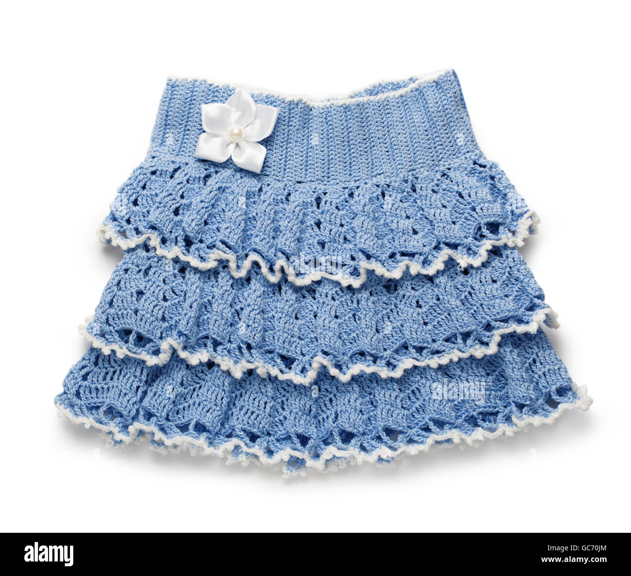 Blue knitted skirt with flower for girl Stock Photo Alamy